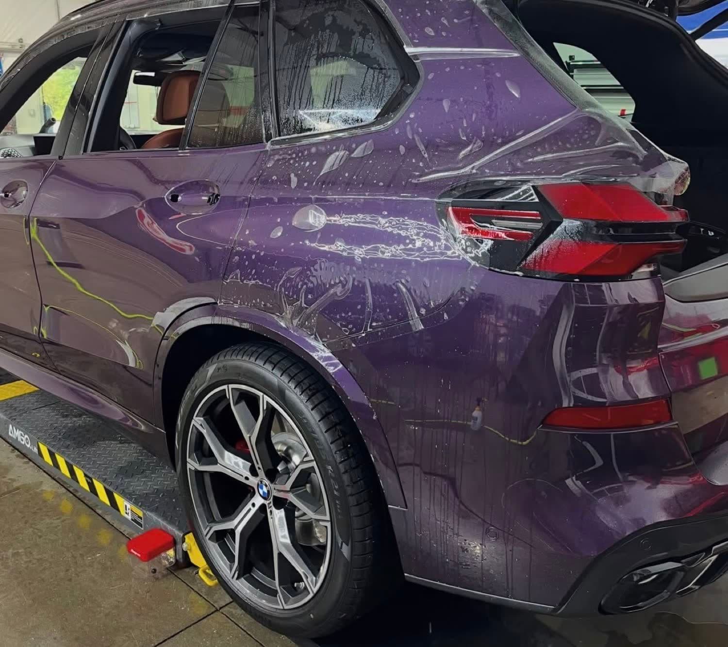 Paint protection film going on a BMW X5 door with the handles removed
