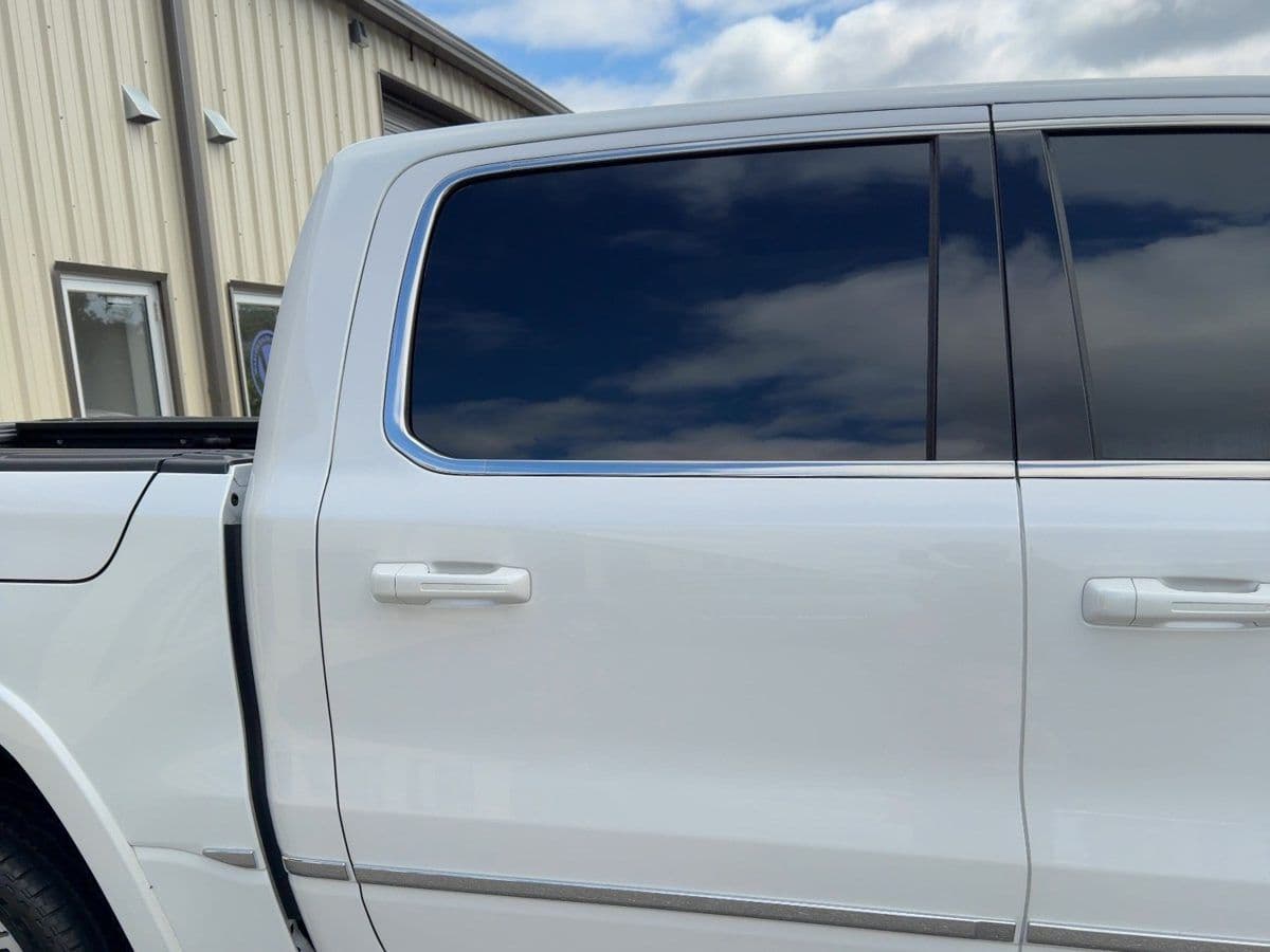A white Ram 1500 with ceramic window tint