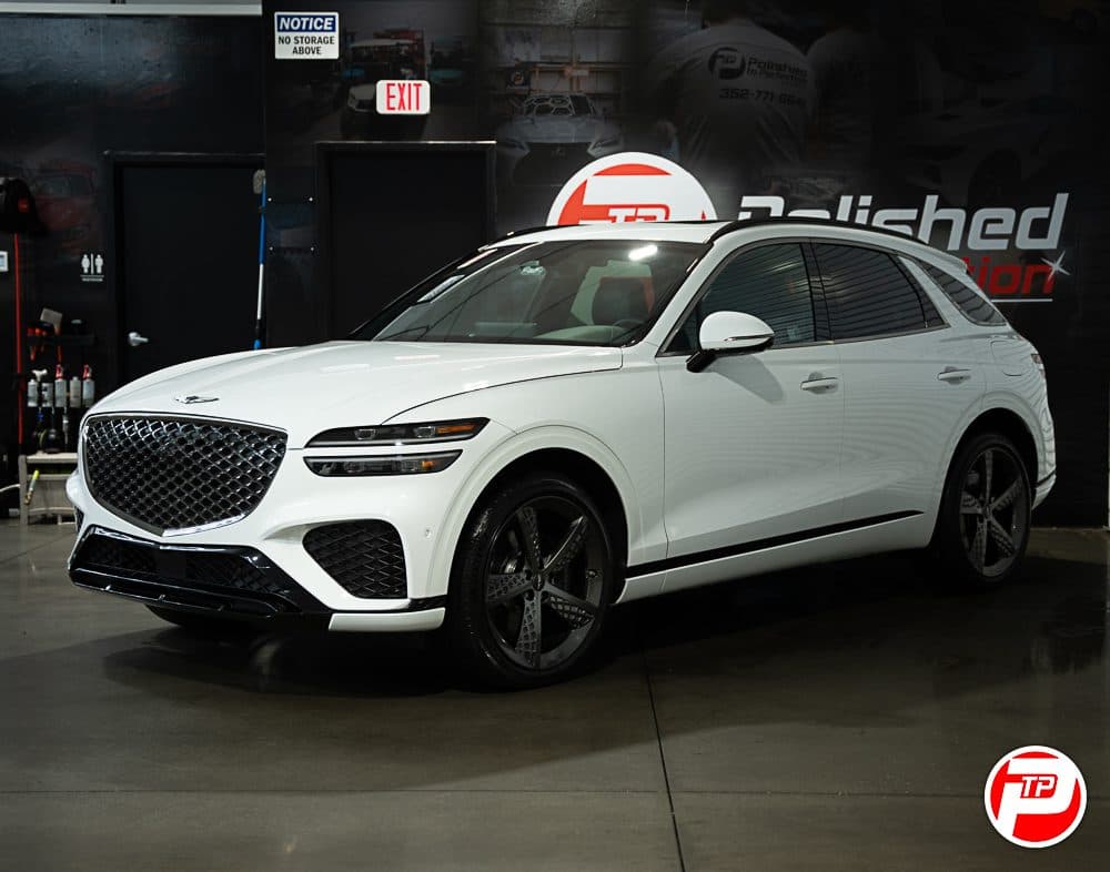 White Genesis GV70 with dark ceramic window tint in the Polished to Perfection studio