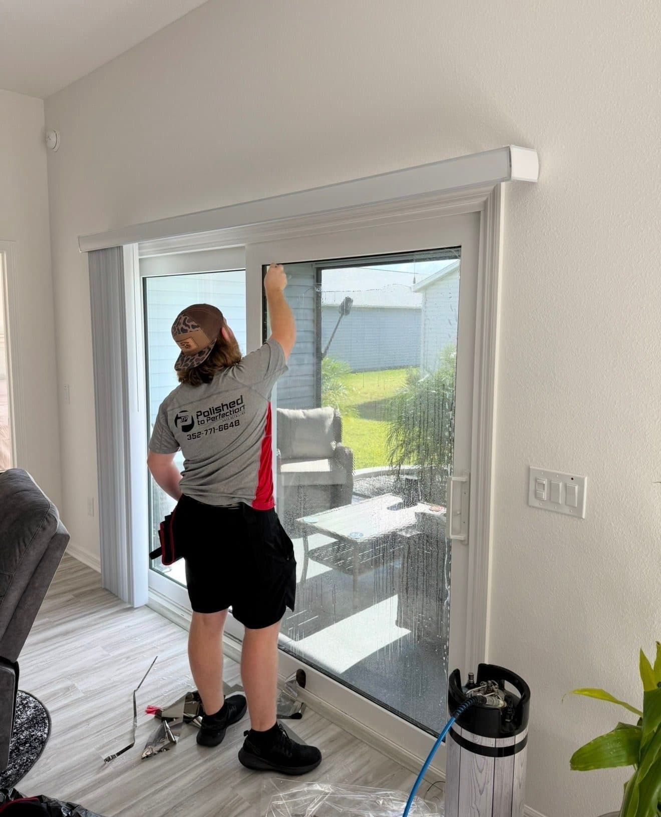 Our installer applying film to a sliding glass door