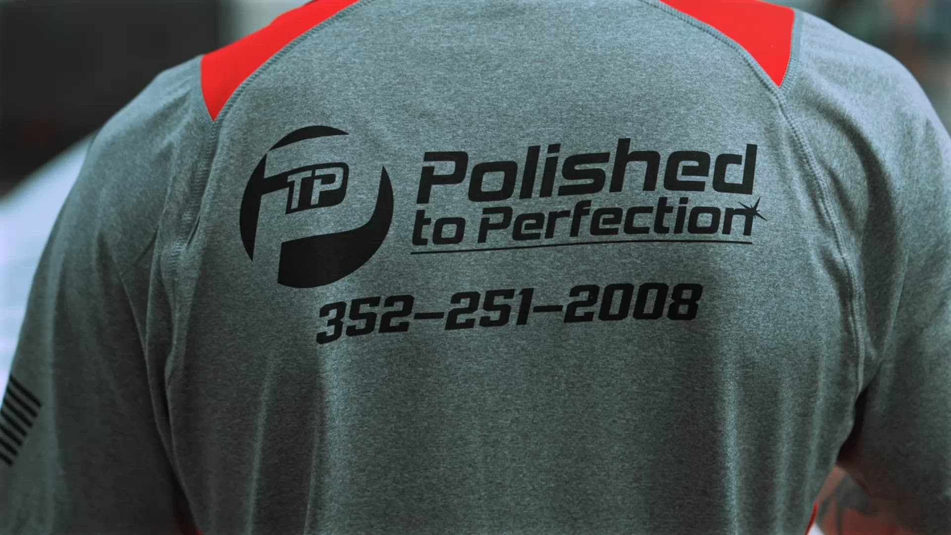 The back of a Polished to Perfection team shirt