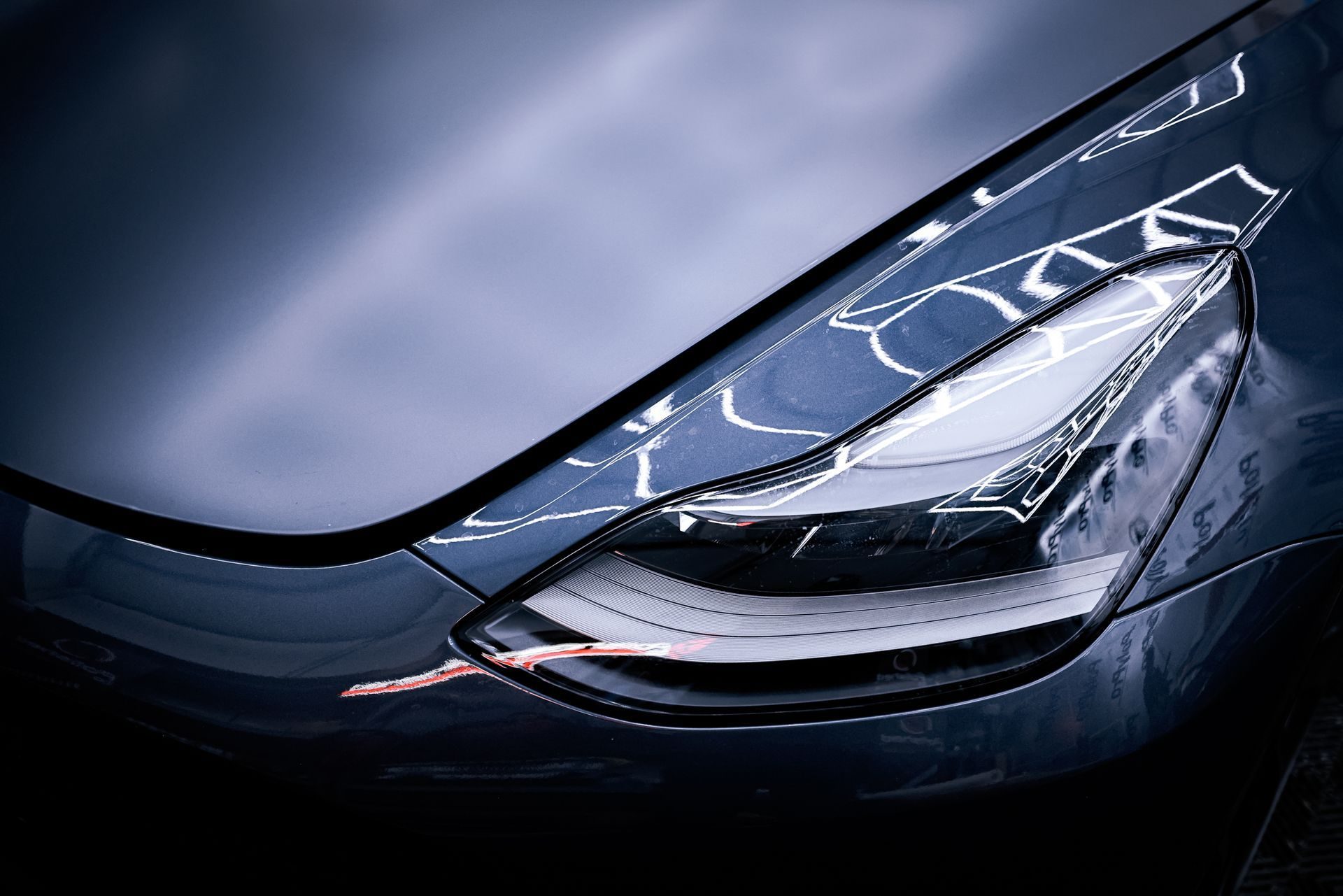 A Tesla with matte paint protection film on the hood